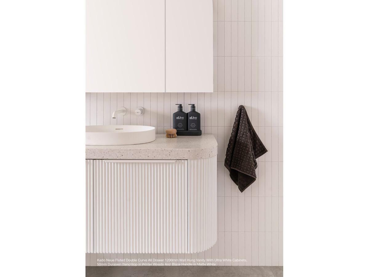 Kado Neue Fluted Double Curve All Drawer 1200mm Wall Hung vanity with Ultra White cabinets, 50mm Durasein benchtop in Winter Woods and Blaze handle in Matte White